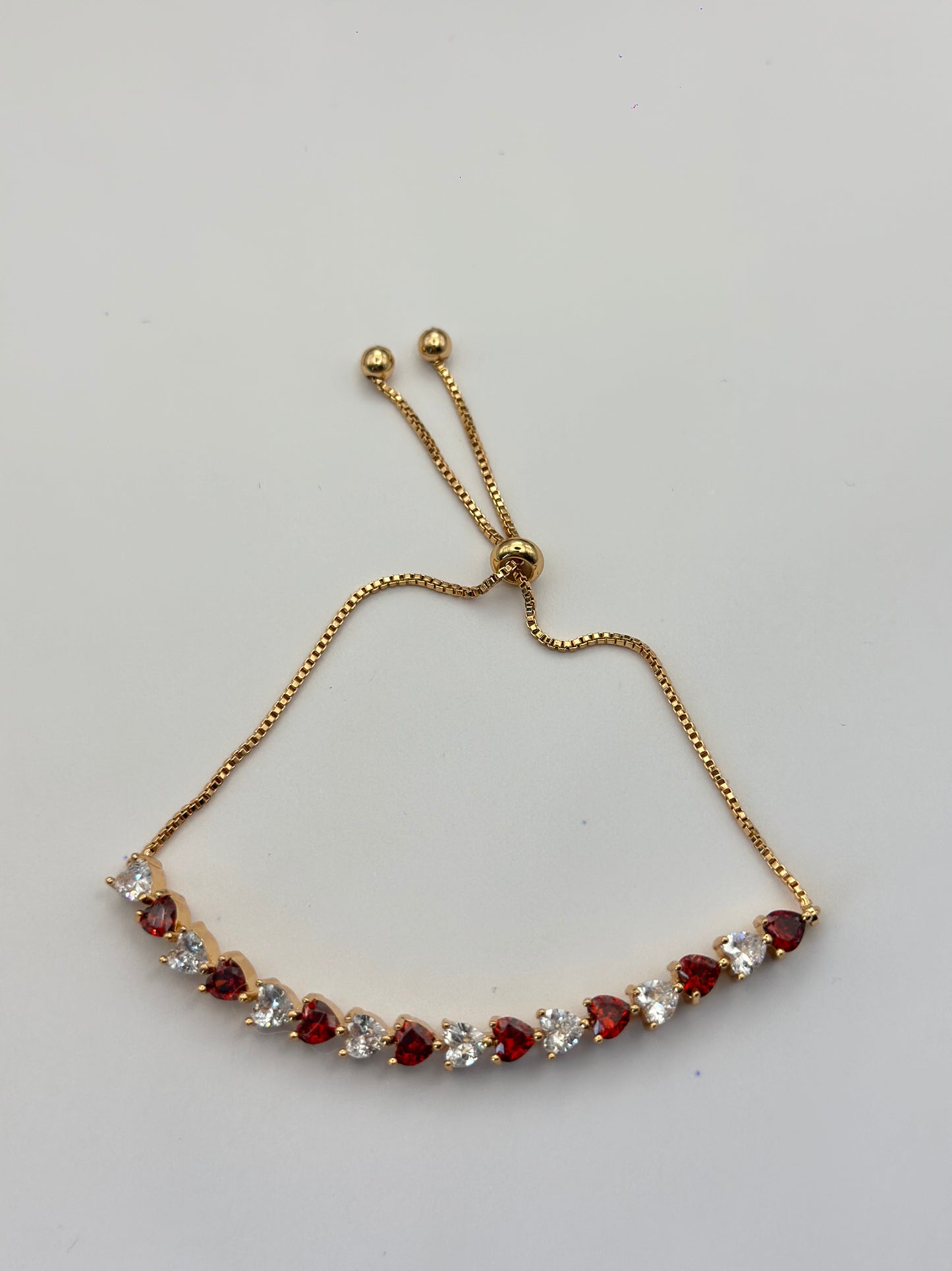 pulsera de corazones bicolor