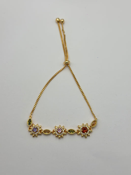 pulsera de soles con piedras de colores