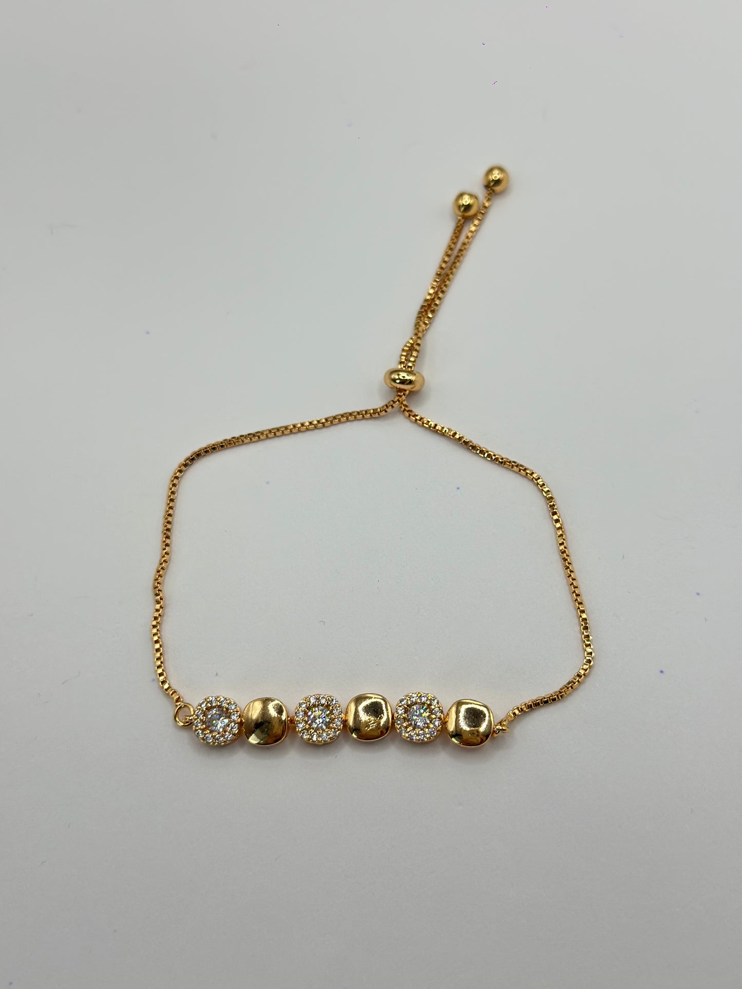 PULSERA AJUSTABLE ESTACIONES DORADAS