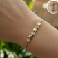 PULSERA AJUSTABLE ESTACIONES DORADAS
