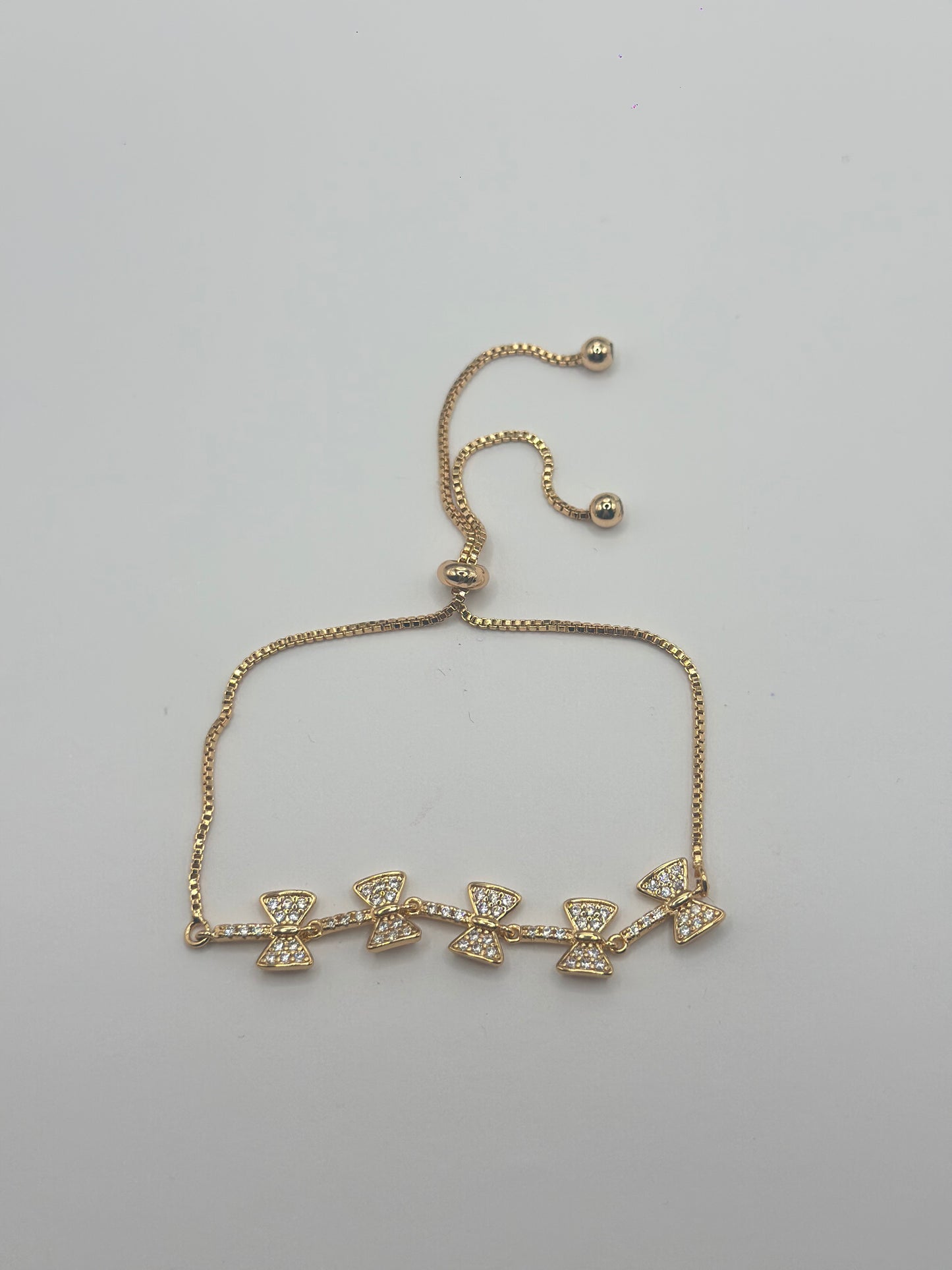 Pulsera ajustable de moños brillantes