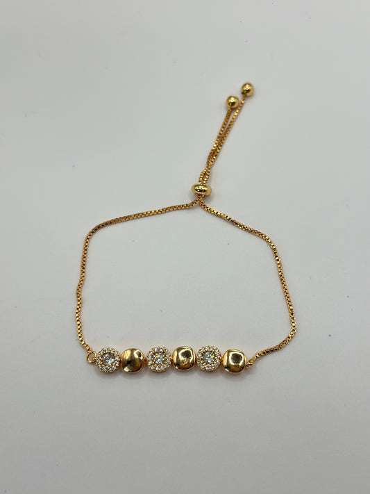 PULSERA AJUSTABLE ESTACIONES DORADAS