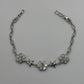 PULSERA ESTRELLAS Y FLORES PAVÉ